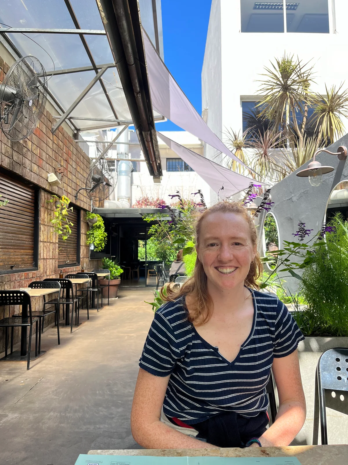 Harriet McCay sitting outside at a café
